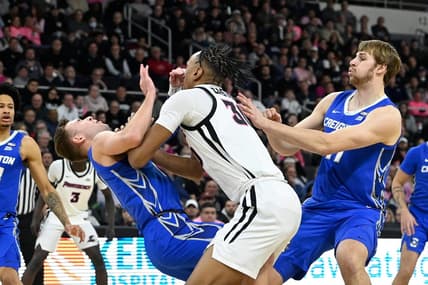 Feb 7, 2024; Providence, Rhode Island, USA; Creighton Bluejays guard Steven Ashworth (1)  is folded by Providence Friars forward Rafael Castro (30) during the first half at Amica Mutual Pavilion. Mandatory Credit: Eric Canha-USA TODAY Sports