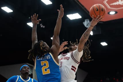 Feb 7, 2024; Stanford, California, USA; Stanford Cardinal guard Andrej Stojakovic (2) attempts to shoot over UCLA Bruins guard Dylan Andrews (2) during the first half at Maples Pavilion. Mandatory Credit: Stan Szeto-USA TODAY Sports