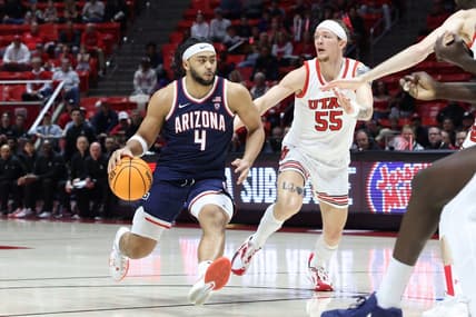 Feb 8, 2024; Salt Lake City, Utah, USA; Arizona Wildcats guard Kylan Boswell (4) brings the ball up the court against Utah Utes guard Gabe Madsen (55) during the first half at Jon M. Huntsman Center. Mandatory Credit: Rob Gray-USA TODAY Sports