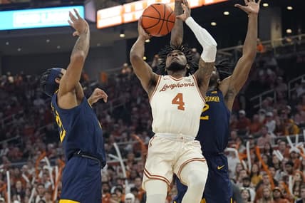 Feb 10, 2024; Austin, Texas, USA; Texas Longhorns guard Tyrese Hunter (4) shoots against West Virginia Mountaineers guards RaeQuan Battle (21) and Kobe Johnson (2) during the first half at Moody Center. Mandatory Credit: Scott Wachter-USA TODAY Sports