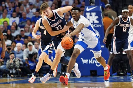 Feb 10, 2024; Lexington, Kentucky, USA; Gonzaga Bulldogs forward Ben Gregg (33) and Kentucky Wildcats guard Adou Thiero (3) chase down the ball during the first half at Rupp Arena at Central Bank Center. Mandatory Credit: Jordan Prather-USA TODAY Sports