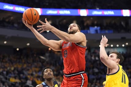 Feb 10, 2024; Milwaukee, Wisconsin, USA;  St. John's Red Storm guard Chris Ledlum (8) shoots  in front of Marquette Golden Eagles guard Tyler Kolek (11) during the first half at Fiserv Forum. Mandatory Credit: Jeff Hanisch-USA TODAY Sports