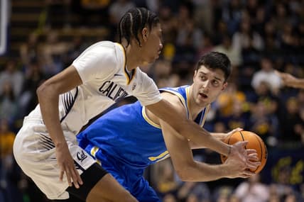Feb 10, 2024; Berkeley, California, USA; UCLA Bruins guard Lazar Stefanovic (right) looks to pass around California Golden Bears guard Rodney Brown Jr. (1) during the first half at Haas Pavilion. Mandatory Credit: D. Ross Cameron-USA TODAY Sports
