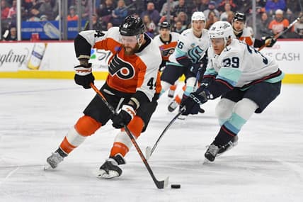 Feb 10, 2024; Philadelphia, Pennsylvania, USA; Philadelphia Flyers left wing Nicolas Deslauriers (44) is defended by Seattle Kraken defenseman Ryker Evans (39) during the first period at Wells Fargo Center. Mandatory Credit: Eric Hartline-USA TODAY Sports