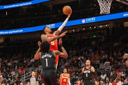 Feb 10, 2024; Atlanta, Georgia, USA; Atlanta Hawks guard Dejounte Murray (5) shoots against the Houston Rockets in the second quarter at State Farm Arena. Mandatory Credit: Brett Davis-USA TODAY Sports