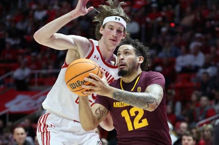 Feb 10, 2024; Salt Lake City, Utah, USA; Arizona State Sun Devils guard Jose Perez (12) goes to the basket against Utah Utes center Branden Carlson (35) during the first half at Jon M. Huntsman Center. Mandatory Credit: Rob Gray-USA TODAY Sports