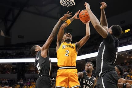 Feb 10, 2024; Columbia, Missouri, USA; Missouri Tigers guard Tamar Bates (2) shoots and is fouled by Mississippi State Bulldogs guard Shawn Jones Jr. (5) during the first half at Mizzou Arena. Mandatory Credit: Denny Medley-USA TODAY Sports