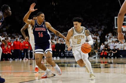 Feb 10, 2024; Boulder, Colorado, USA; Colorado Buffaloes guard KJ Simpson (2) controls the ball against Arizona Wildcats forward Keshad Johnson (16) in the second half at CU Events Center. Mandatory Credit: Isaiah J. Downing-USA TODAY Sports