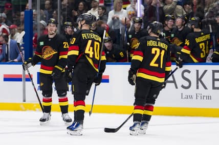 Feb 15, 2024; Vancouver, British Columbia, CAN; Vancouver Canucks forward Nils Hoglander (21) and forward Elias Pettersson (40) and celebrate Lindholm s second goal of the game against the Detroit Red Wings in the third period at Rogers Arena. Vancouver won 4-1. Mandatory Credit: Bob Frid-USA TODAY Sports