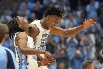 Feb 17, 2024; Chapel Hill, North Carolina, USA; North Carolina Tar Heels forward Harrison Ingram (55) and forward Jae'Lyn Withers (24) celebrate in the first half at Dean E. Smith Center. Mandatory Credit: Bob Donnan-USA TODAY Sports