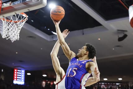Feb 17, 2024; Norman, Oklahoma, USA; Kansas Jayhawks guard Kevin McCullar Jr. (15) goes to the basket against the Oklahoma Sooners during the first half at Lloyd Noble Center. Mandatory Credit: Alonzo Adams-USA TODAY Sports