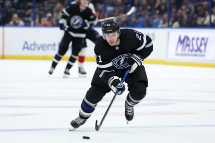 Feb 17, 2024; Tampa, Florida, USA;  Tampa Bay Lightning center Brayden Point (21) controls the puck against the Florida Panthers in the third period at Amalie Arena. Mandatory Credit: Nathan Ray Seebeck-USA TODAY Sports