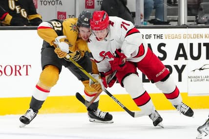 Feb 17, 2024; Las Vegas, Nevada, USA; Vegas Golden Knights center Brett Howden (21) skates against Carolina Hurricanes right wing Jesper Fast (71) during the first period at T-Mobile Arena. Mandatory Credit: Stephen R. Sylvanie-USA TODAY Sports