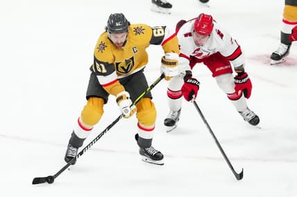 Feb 17, 2024; Las Vegas, Nevada, USA; Vegas Golden Knights right wing Mark Stone (61) skates against Carolina Hurricanes defenseman Dmitry Orlov (7) during the third period at T-Mobile Arena. Mandatory Credit: Stephen R. Sylvanie-USA TODAY Sports