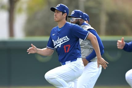 Feb 18, 2024; Glendale, AZ, USA;  Los Angeles Dodgers designated hitter Shohei Ohtani (17) stretches during spring training at Camelback Ranch. Mandatory Credit: Jayne Kamin-Oncea-USA TODAY Sports