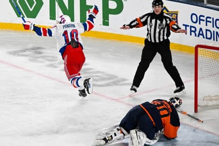 Feb 18, 2024; East Rutherford, New Jersey, USA;  New York Rangers left wing Artemi Panarin (10) celebrates his game winning goal against the New York Islanders during the overtime period in a Stadium Series ice hockey game at MetLife Stadium. Mandatory Credit: Dennis Schneidler-USA TODAY Sports