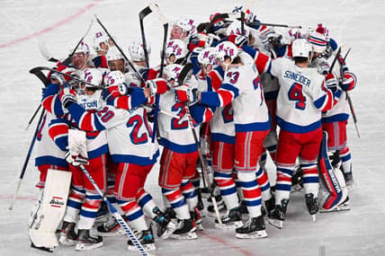 Feb 18, 2024; East Rutherford, New Jersey, USA;  The New York Rangers  celebrate the 6-5 victory over the the New York Islanders  after the game in a Stadium Series ice hockey game at MetLife Stadium. Mandatory Credit: Dennis Schneidler-USA TODAY Sports