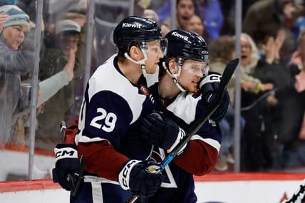 Feb 18, 2024; Denver, Colorado, USA; Colorado Avalanche center Nathan MacKinnon (29) celebrates his goal with defenseman Bowen Byram (4) in the second period against the Arizona Coyotes at Ball Arena. Mandatory Credit: Isaiah J. Downing-USA TODAY Sports