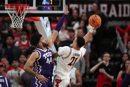 Feb 20, 2024; Lubbock, Texas, USA;  Texas Tech Red Raiders forward KyeRon Lindsey (21) shoots against TCU Horned Frogs forward Essam Mostafa (44) in the first half at United Supermarkets Arena. Mandatory Credit: Michael C. Johnson-USA TODAY Sports