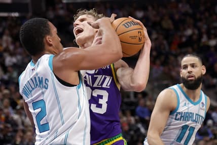 Feb 22, 2024; Salt Lake City, Utah, USA;  Utah Jazz forward Lauri Markkanen (23) is fouled by Charlotte Hornets forward Grant Williams (2) during the second quarter at Delta Center. Mandatory Credit: Chris Nicoll-USA TODAY Sports