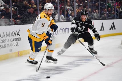 Feb 22, 2024; Los Angeles, California, USA; Nashville Predators left wing Filip Forsberg (9) controls the puck against Los Angeles Kings defenseman Vladislav Gavrikov (84) during the first period at Crypto.com Arena. Mandatory Credit: Gary A. Vasquez-USA TODAY Sports