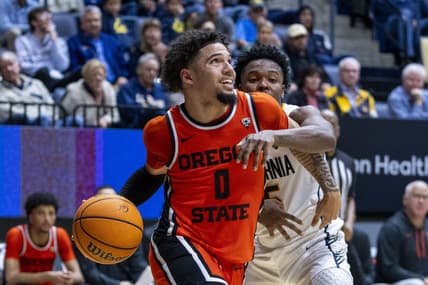 February 22, 2024; Berkeley, California, USA; Oregon State Beavers guard Jordan Pope (0) dribbles the basketball against California Golden Bears guard Jalen Cone (15) during the second half at Haas Pavilion. Mandatory Credit: Kyle Terada-USA TODAY Sports
