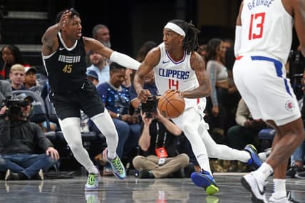 Feb 23, 2024; Memphis, Tennessee, USA; Los Angeles Clippers guard Terance Mann (14) drives to the basket as Memphis Grizzlies forward GG Jackson (45) defends during the first half at FedExForum. Mandatory Credit: Petre Thomas-USA TODAY Sports