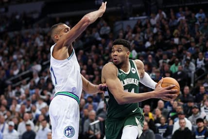 Feb 23, 2024; Minneapolis, Minnesota, USA; Milwaukee Bucks forward Giannis Antetokounmpo (34) works around Minnesota Timberwolves center Rudy Gobert (27) during the first half at Target Center. Mandatory Credit: Matt Krohn-USA TODAY Sports