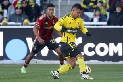 Feb 24, 2024; Columbus, Ohio, USA; Columbus Crew forward Cucho Hernandez (9) dribbles the ball past Atlanta United defender Caleb Wiley (26) during the first half at Lower.com Field. Mandatory Credit: Trevor Ruszkowski-USA TODAY Sports