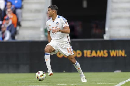 Feb 25, 2024; Cincinnati, Ohio, USA; FC Cincinnati defender Miles Robinson (12) dribbles against Toronto FC in the first half at TQL Stadium. Mandatory Credit: Katie Stratman-USA TODAY Sports