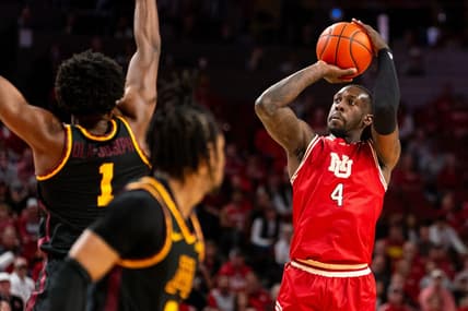 Feb 25, 2024; Lincoln, Nebraska, USA; Nebraska Cornhuskers forward Juwan Gary (4) shoots the ball against Minnesota Golden Gophers forward Joshua Ola-Joseph (1) and guard Elijah Hawkins (0) during the first half at Pinnacle Bank Arena. Mandatory Credit: Dylan Widger-USA TODAY Sports