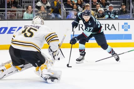 Feb 26, 2024; Seattle, Washington, USA; Seattle Kraken center Yanni Gourde (37) skates with the puck against the Boston Bruins during the first period at Climate Pledge Arena. Mandatory Credit: Joe Nicholson-USA TODAY Sports