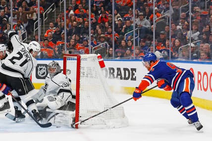 Feb 26, 2024; Edmonton, Alberta, CAN; Edmonton Oilers forward Connor McDavid (97) tries a wrap-around on Los Angeles Kings goaltender David Rittich (31) during the second period at Rogers Place. Mandatory Credit: Perry Nelson-USA TODAY Sports