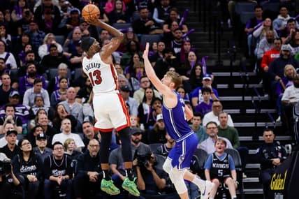 Feb 26, 2024; Sacramento, California, USA; Miami Heat center Bam Adebayo (13) shoots the ball over Sacramento Kings forward Domantas Sabonis (10) during the fourth quarter at Golden 1 Center. Mandatory Credit: Sergio Estrada-USA TODAY Sports