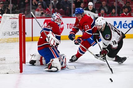 Feb 27, 2024; Montreal, Quebec, CAN; Montreal Canadiens goalie Sam Montembeault (35) makes a save against Arizona Coyotes left wing Jason Zucker (16) during the first period at Bell Centre. Mandatory Credit: David Kirouac-USA TODAY Sports