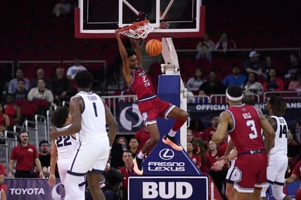 Feb 27, 2024; Fresno, California, USA; Fresno State Bulldogs guard Leo Colimerio (23) dunks the ball against the Utah State Aggies in the first half at the Save Mart Center. Mandatory Credit: Cary Edmondson-USA TODAY Sports