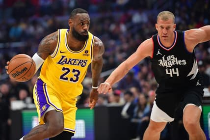 Feb 28, 2024; Los Angeles, California, USA; Los Angeles Lakers forward LeBron James (23) moves the ball against Los Angeles Clippers center Mason Plumlee (44) during the first half at Crypto.com Arena. Mandatory Credit: Gary A. Vasquez-USA TODAY Sports