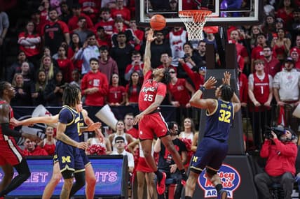 Feb 29, 2024; Piscataway, New Jersey, USA; Rutgers Scarlet Knights guard Jeremiah Williams (25) scores a basket in front of Michigan Wolverines forward Tarris Reed Jr. (32) during the first half at Jersey Mike's Arena. Mandatory Credit: Vincent Carchietta-USA TODAY Sports