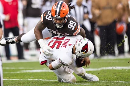 Nov 5, 2023; Cleveland, Ohio, USA; Cleveland Browns defensive end Za'Darius Smith (99) sacks Arizona Cardinals quarterback Clayton Tune (15) during the fourth quarter at Cleveland Browns Stadium. Mandatory Credit: Scott Galvin-USA TODAY Sports