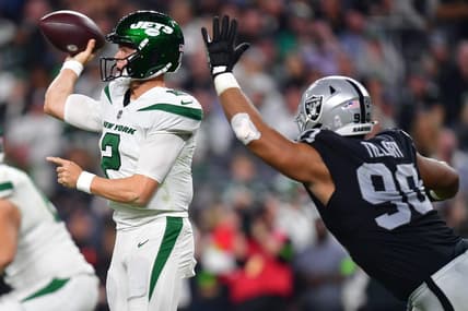 Nov 12, 2023; Paradise, Nevada, USA; New York Jets quarterback Zach Wilson (2) throws under pressure from Las Vegas Raiders defensive tackle Jerry Tillery (90) during the second half at Allegiant Stadium. Mandatory Credit: Gary A. Vasquez-USA TODAY Sports