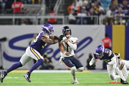 Nov 27, 2023; Minneapolis, Minnesota, USA; Chicago Bears quarterback Justin Fields (1) is tackled by Minnesota Vikings linebacker Danielle Hunter (99) and cornerback Mekhi Blackmon (5) as wide receiver Darnell Mooney (11) looks to block during the fourth quarter at U.S. Bank Stadium. Mandatory Credit: Jeffrey Becker-USA TODAY Sports