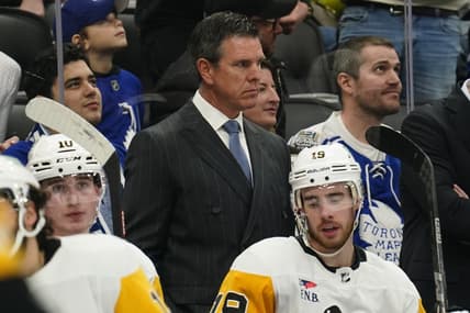 Dec 16, 2023; Toronto, Ontario, CAN; Pittsburgh Penguins head coach Mike Sullivan (middle) looks on from the bench during the second period against the Toronto Maple Leafs at Scotiabank Arena. Mandatory Credit: John E. Sokolowski-USA TODAY Sports