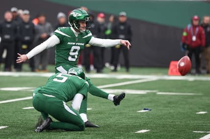 Dec 24, 2023; East Rutherford, New Jersey, USA; New York Jets place kicker Greg Zuerlein (9) kicks a field goal as punter Thomas Morstead (5) holds during the first half against the Washington Commanders at MetLife Stadium. Mandatory Credit: Vincent Carchietta-USA TODAY Sports