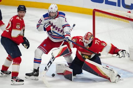 Dec 29, 2023; Sunrise, Florida, USA; Florida Panthers goaltender Sergei Bobrovsky (72) stops a shot behind New York Rangers center Barclay Goodrow (21) during the third period at Amerant Bank Arena. Mandatory Credit: Jasen Vinlove-USA TODAY Sports