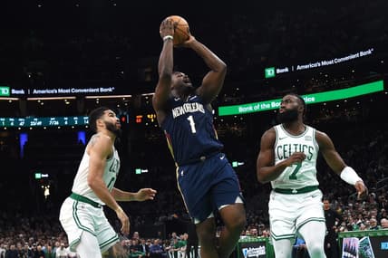 Jan 29, 2024; Boston, Massachusetts, USA;  New Orleans Pelicans forward Zion Williamson (1) shoots the ball between Boston Celtics forward Jayson Tatum (0) and guard Jaylen Brown (7) during the second half at TD Garden. Mandatory Credit: Bob DeChiara-USA TODAY Sports