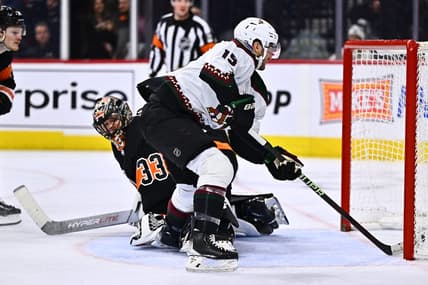 Feb 12, 2024; Philadelphia, Pennsylvania, USA; Arizona Coyotes center Alex Kerfoot (15) scores a goal against Philadelphia Flyers goalie Samuel Ersson (33) in the second period at Wells Fargo Center. Mandatory Credit: Kyle Ross-USA TODAY Sports