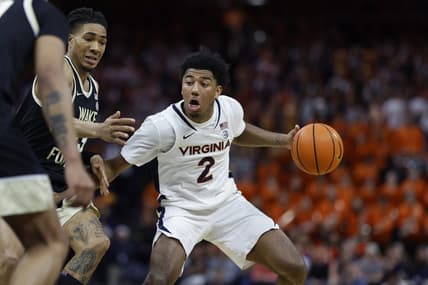 Feb 17, 2024; Charlottesville, Virginia, USA; Virginia Cavaliers guard Reece Beekman (2) drives to the basket as Wake Forest Demon Deacons guard Hunter Sallis (23) defends in the second half at John Paul Jones Arena. Mandatory Credit: Geoff Burke-USA TODAY Sports