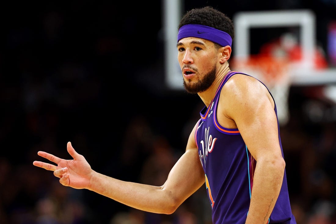 Feb 25, 2024; Phoenix, Arizona, USA; Phoenix Suns guard Devin Booker (1) reacts after a play during the first quarter of the game against the Los Angeles Lakers at Footprint Center. Mandatory Credit: Mark J. Rebilas-USA TODAY Sports