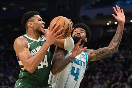 Feb 27, 2024; Milwaukee, Wisconsin, USA; Milwaukee Bucks forward Giannis Antetokounmpo (34) drives for the basket against Charlotte Hornets center Nick Richards (4) in the third quarter at Fiserv Forum. Mandatory Credit: Benny Sieu-USA TODAY Sports