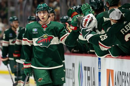 Feb 27, 2024; Saint Paul, Minnesota, USA; Minnesota Wild center Connor Dewar (26) celebrates his goal against the Carolina Hurricanes during the first period at Xcel Energy Center. Mandatory Credit: Matt Krohn-USA TODAY Sports